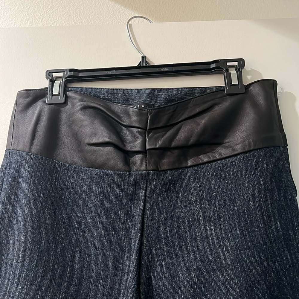Parallel denim with lamb skin trim. Used, excellent condition.